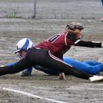 Thunder Mountain junior Jenna Dobson is caught off base on a fly ball out and is put out at first base by Ketchikan junior Rylie Welk during the Lady Falcons 14-11 loss to the Lady Kings on Friday at Dimond Park field. (Klas Stolpe / Juneau Empire)