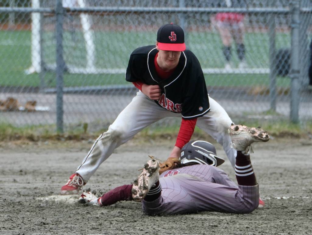 JDHS third baseman Reed Meier tags out Ketchikan runner Bubba Williams during Saturday baseball action at Adair Kennedy Field. (Klas Stolpe / Juneau Empire)