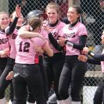 Juneau-Douglas High School: Yadaa.at Kalé senior Anna Dale is hugged by classmate Gloria Bixby (12) as players celebrate her game winning hit during Saturday's extra inning win over Ketchikan at Melvin Park. (Klas Stolpe / Juneau empire).