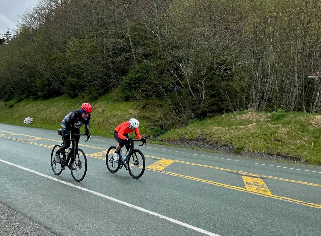 Jamie Bursell, right, nips Dave Ringle, left, at the finish of the Tee Harbor Road Race on Saturday. (Courtesy Photo / Juneau Freewheelers)