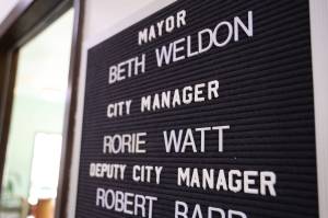 A sign hangs outside of outgoing City Manager Rorie Watts office located in the City Hall downtown. On Monday the Assembly City Manager Recruitment Committee met for the first time to discuss the recruitment process to hire Watts replacement by the end of September. (Clarise Larson / Juneau Empire)