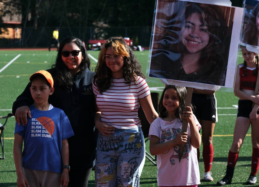 JDHS senior Angelica Rodriguez and family members during the Crimson Bears girls soccer senior recognition at the Adair-Kennedy pitch Tuesday. (Klas Stolpe / Juneau Empire)