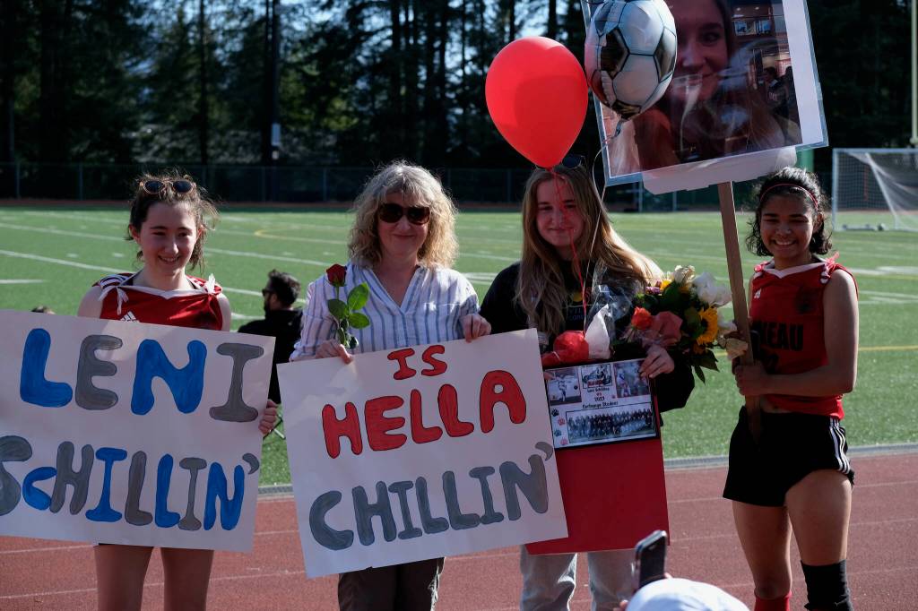 JDHS German exchange student Leni Schilling and host family during the Crimson Bears girls soccer senior recognition at the Adair-Kennedy pitch Tuesday. (Klas Stolpe / Juneau Empire)