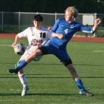 JDHS sophomore Kellen Chester (10) and TMHS senior Matthew Spratt (4) battle for a ball during the Crimson Bears 6-1 win over the Falcons Tuesday at Falcons Field. (Klas Stolpe / Juneau Empire)