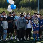 Thunder Mountain senior MJ Tupou with family and friends during the Falcons boys soccer senior recognition Tuesday at Falcons Field. (Klas Stolpe / Juneau Empire)