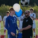Thunder Mountain senior Tristan Laremore with coach Tim Lewis during the Falcons boys soccer senior recognition Tuesday at Falcons Field. (Klas Stolpe / Juneau Empire)