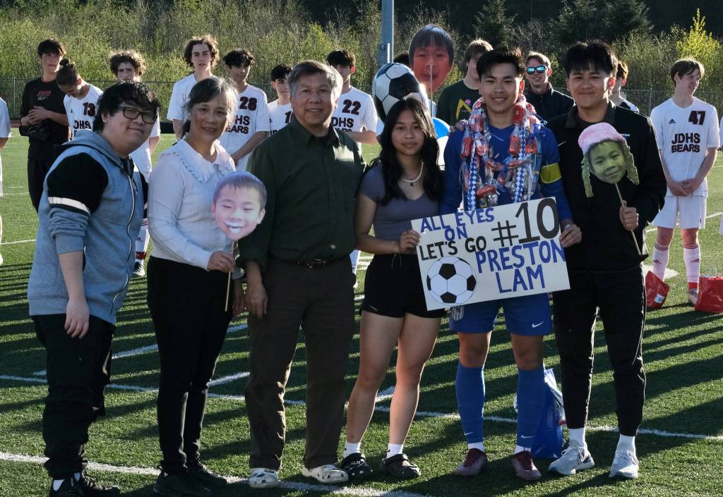 Thunder Mountain senior Preston Lam with family during the Falcons boys soccer senior recognition Tuesday at Falcons Field. (Klas Stolpe / Juneau Empire)