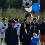 Thunder Mountain senior Ben Erickson with family during the Falcons boys soccer senior recognition Tuesday at Falcons Field. (Klas Stolpe / Juneau Empire)