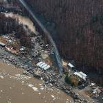 In this aerial photo chunks of ice follow flooding from an ice jam in Crooked Creek, Alaska, May 15, 2023. Ice jams along two Alaska rivers unleashed major flooding over the weekend. (Jennifer Wallace / Alaska Division of Homeland Security and Emergency Management)