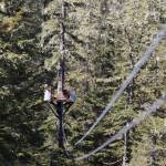 A wire cable stretches high above the forest ground and connects two platforms for zip lining at Eaglecrest Ski Area. Zip line tours are set to be offered again this summer at the ski area starting in late June after three years of halted operations due to COVID-19 and staffing issues. (Clarise Larson / Juneau Empire)