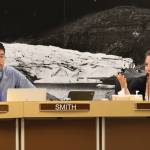 City and Borough of Juneau Assembly member Greg Smith and Christine Woll discuss the mill rate during Wednesday nights Finance Committee meeting. Member voted to decrease the mill rate to 10.16. (Clarise Larson / Juneau Empire)