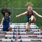 Sitka freshman Natalie Hall and Petersburg senior Alexus Sakamoto Quezon race a preliminary hurdle during the Region V Track & Field Championships, Friday, at Thunder Mountain. The championships resume Saturday. (Klas Stolpe / Juneau Empire)