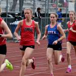 JDHS sophomore Ida Meyer leads JDHS junior Etta Eller, Sitka senior Anna Prussian, JDHS junior Rayna Tuckwood and JDHS sophomore Pacific Ricke in the 3200 during the Region V Track & Field Championships, Friday, at Thunder Mountain. Meyer won the race in 11:34.27. The championships resume Saturday. (Klas Stolpe / Juneau Empire)