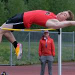 JDHS junior Brendan West wins the DI high jump as coach Jesse Stringer looks on during the Region V Track & Field Championships, Friday, at Thunder Mountain. The championships resume Saturday. (Klas Stolpe / Juneau Empire)