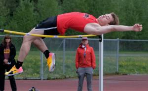 JDHS junior Brendan West wins the DI high jump as coach Jesse Stringer looks on during the Region V Track & Field Championships, Friday, at Thunder Mountain. The championships resume Saturday. (Klas Stolpe / Juneau Empire)