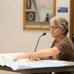 Nancy Waterman point to a map of Juneau and Douglas during an open forum about a second crossing between the Juneau mainland and Douglas Island hosted by the City and Borough of Juneau Public Works and Facilities Committee Thursday evening. (Clarise Larson / Juneau Empire)