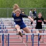 Thunder Mountain High School senior Mallory Welling leads the field en route to winning the girls 100 meter hurdles during the Region V Track & Field Championships, Saturday, at TMHS. From left: Ketchikan junior Linnea Loretan, Welling, Juneau-Douglas junior Hannah Brennell and JDHS freshman Isabella Reyes-Boyer. (Klas Stolpe / Juneau Empire)