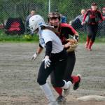Juneau-Douglas High School: Yadaa.at Kalé senior second baseman Gloria Bixby chases Thunder Mountain sophomore base runner Bryanna Eakes in a run down Saturday at Melvin Park during the Crimson Bears senior recognition series against the Falcons. (Klas Stolpe / Juneau Empire)