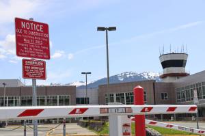A sign at the entrance of the Juneau International Airports short-term parking lot informs travelers that construction will begin May 31 and long-term parking will be closed the same day. The airports construction project will begin next Wednesday, May 31, for parking lot improvements, including repaving, new curbing, lighting and draining, as well as installing a new payment system in the short-term lot. ( Clarise Larson / Juneau Empire)