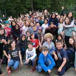 Sayéik: Gastineau Community School students pose with physical education teacher Dirk Miller, top middle, during Field Day at the school on Thursday. Miller is retiring after 24 years at the school. (Klas Stolpe / Juneau Empire)