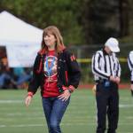 Outgoing Juneau School District Superintendent Bridget Weiss walks off the field after participating as the games honorary coin tosser. (Clarise Larson / Juneau Empire)