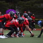 Players line up during the final quarter of Juneau Alumni Football game on Friday at Adair-Kennedy Memorial Park. (Clarise Larson / Juneau Empire)