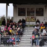 Fans and family members fill the bleachers at Adair-Kennedy Field on Friday during the Juneau Alumni Football game. (Clarise Larson / Juneau Empire)