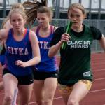 Sitka sophomore Clare Mullin and Haines senior Avari Getchell start the anchor leg of the Division II girls 4x400 relay after taking baton passes from Sitka freshman Natalie Hall and Haines sophomore Ariel Godinez Long during the Region V Track & Field Championships. Sitka performed well at the state championship this weekend, earning a Division II title. (Klas Stolpe / Juneau Empire)
