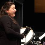 Sara Radke Brown sings a composition from The Lord of the Rings film trilogy during a concert rehearsal Tuesday at Juneau-Douglas High School: Yadaa.at Kalé. Two concerts this weekend will feature the first vocal performances ever under current music director Christopher Koch. (Mark Sabbatini / Juneau Empire)