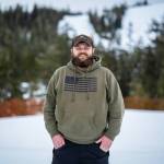 Ben Bullock, outdoor education program coordinator for Douglas Indian Association, stands at the base of Eaglecrest Ski Area, where he typically spends his day coordinating Snow Camp alongside volunteers, chaperones and Eaglecrest staff.