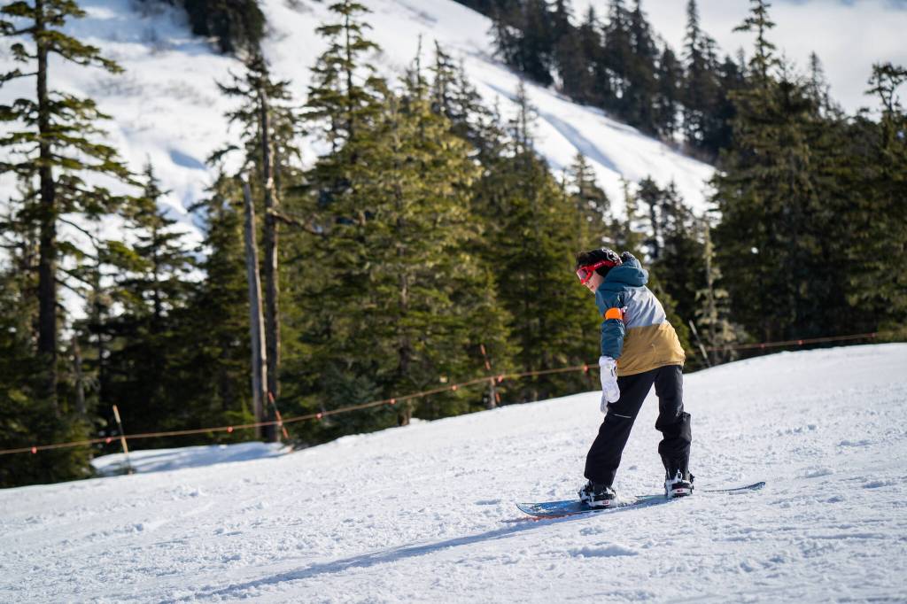 Hania Richey smoothly rides down a run from the Hooter chairlift, where Snow Camp participants go after theyve graduated from the more mellow slopes. (Photo by Lee House / Sitka Conservation Society)
