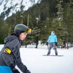 Aliyah Merculief focuses on her run while snowboarding at Snow Camp. (Photo by Lee House / Sitka Conservation Society)