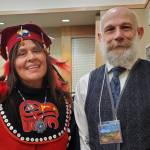 Jacque Tagaban (left) and Adam Bauer (right) smile for a photo at the Alaska Baháí National Convention in late May. (Courtesy Photo / Adam Bauer)