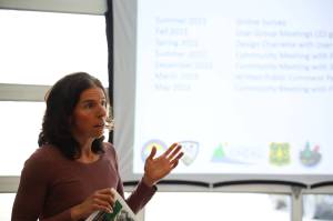 Michele Elfers, deputy director of CBJ Parks and Recreation, speaks to about 15 residents who attended a public meeting discussing the final version of the Montana Creek master plan at the Trail Mix Inc. shop Wednesday evening. (Clarise Larson / Juneau Empire)