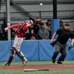 JDHS junior catcher Lamar Blatnick reaches for a foul ball as umpire Keith Perkins looks on during the Crimson Bears 9-1 loss to the Colony Knights on Thursday in the opening round of the ASAA Division I State Baseball Championships at Sitkas Moller Field. (Klas Stolpe / Juneau Empire)
