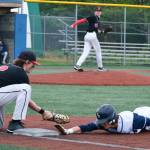 JDHS senior first baseman Bodhi Miller tags out Eagle River junior base runner Gunner Mountcastle on a pick off move from pitcher Eli Crupi during the Crimson Bears 2-1 loss to the Wolves in an elimination game Friday at the ASAA Division I State Baseball Championships on Sitkas Moller Field. (Klas Stolpe / Juneau Empire)