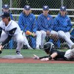 JDHS junior Lamar Blatnick slides safely into third base as Eagle River senior Alexander Mullen bobbles the ball during the Crimson Bears 2-1 loss to the Wolves in an elimination game Friday at the ASAA Division I State Baseball Championships on Sitkas Moller Field. (Klas Stolpe / Juneau Empire)