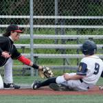 JDHS junior third baseman Landon Simonson tags out an Eagle River base runner during the Crimson Bears 2-1 loss to the Wolves in an elimination game Friday at the ASAA Division I State Baseball Championships on Sitkas Moller Field. (Klas Stolpe / Juneau Empire)