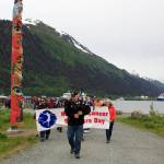 Rai Behnert plays the bagpipes as he leads about 50 people during the final stretch of Cancer Connections annual Celebration of Life Walk from Marine Park to Bill Overstreet Park on Sunday.