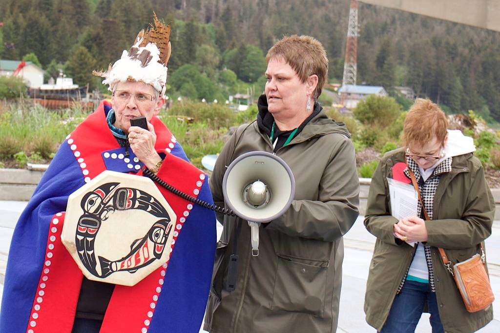 Fran Houston, left, cultural Leader of the Aakw Kwáan, offers an acknowledgement that a Celebration of Life Walk on Sunday in Juneau is taking place on tribal land. Such land acknowledgements have become common at local official events in recent years. The walk was organized by Cancer Connection, with board member Penny Bullington, center, and president Sheryl Weinberg among the key participants. (Mark Sabbatini / Juneau Empire)