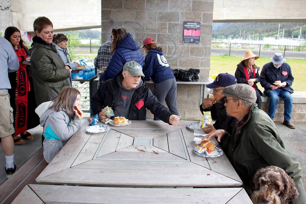 Local residents from a diverse range of ages and cultures gather for a cookout Sunday at Bill Overstreet Park after participating in an annual walk celebrating National Cancer Survivors Day. (Mark Sabbatini / Juneau Empire)