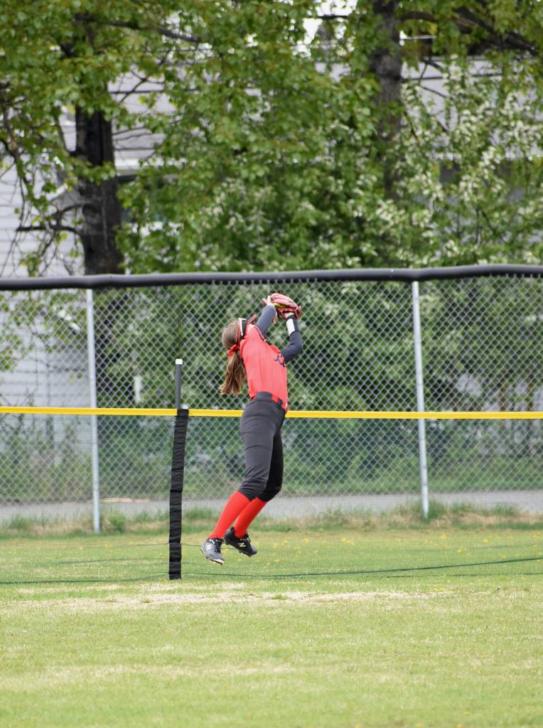 JDHS senior left fielder Carlynn Casperson catches a fly ball out over the fence during the Crimson Bears 6-5 win over the Sitka Wolves on Saturday for the ASAA Division II State Softball Championship at Anchorages Cartee Fields. (Courtesy Photo /JDHS Softball)