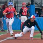 Sitka sophomore Tanner Stinson is safe at first base as West Valley senior Olav Moeller misses a throw during the Wolves 7-2 win in a Friday elimination game at the ASAA Division I State Baseball Championships on Sitka's Moller Field. (Klas Stolpe / Juneau Empire)