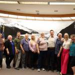 City and Borough of Juneau administration and Assembly members smile for a picture during the Finance Committee meeting Wednesday night, which was city Finance Director Jeff Rogers last finance meeting after serving four years in his position. (Clarise Larson / Juneau Empire)