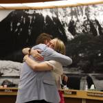 City and Borough of Juneau outgoing Finance Director Jeff Rogers hugs Assembly member and Finance Committee Chair Carole Triem on Wednesday during his final finance meeting with the city. (Clarise Larson / Juneau Empire)