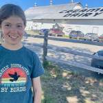 Hazel Sutton, 13, pauses at Creamers Field Migratory Waterfowl Refuge at the end of her shift monitoring tree swallow nest-boxes. (Courtesy Photo / Ned Rozell)
