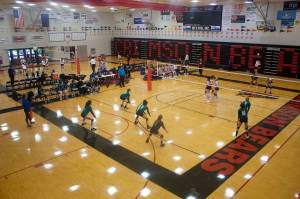 Mark Sabbatini / Juneau Empire File
Girls teams face off on the twin courts of the main gym at Juneau-Douglas Yadaa.at Kalé High School during the Juneau Invitational Volleyball Extravaganza on Oct. 15, 2022. A proposal being considered by the Alaska State Board of Education and Early Development to ban transgender females from participating in girls high school sports could take effect before this years fall sports season.