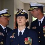 Rear Adm. Megan M. Dean (center) awaits her entrance during a change-of-command Friday in Juneau where she was sworn as the new command of U.S. Coast Guard District 17 at the Alaska Army National Guard Aviation Operating Facility in Juneau. Standing behind to her left is Vice Adm. Andrew J. Tiongson and to her right is outgoing Rear Adm. Nathan A. Moore. (Clarise Larson / Juneau Empire)