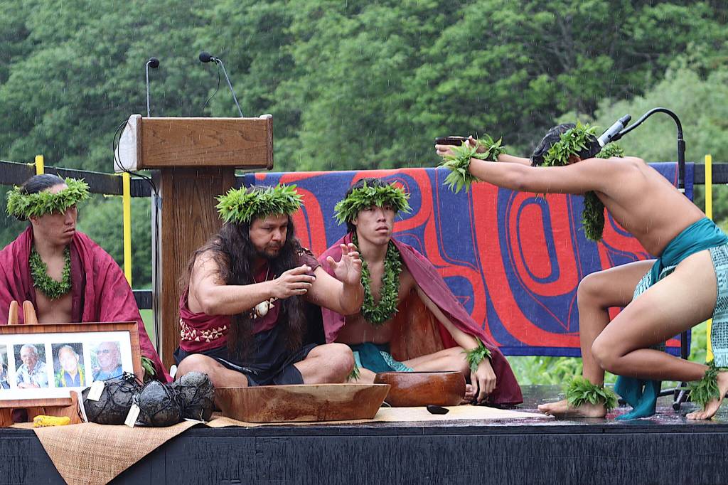 A cultural ceremony by Indigenous visitors from Hawaii is performed during the welcoming of the Hōkūlea at Auke Bay on Saturday afternoon. (Mark Sabbatini / Juneau Empire)