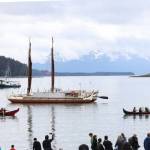 A crowd gathers at the shore of Auke Bay as the Hōkūlea, a double-hulled and wind-powered traditional Polynesian voyaging canoe, arrives in Juneau on Saturday afternoon for a welcoming ceremony. (Clarise Larson / Juneau Empire)